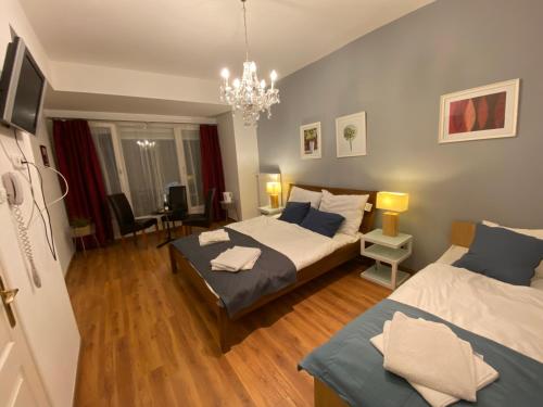 Кровать или кровати в номере Grace Rooms and Apartments Budapest