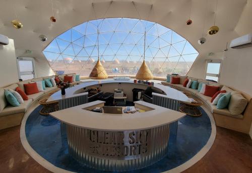 a large lobby with a large window and a circular table at Clear Sky Resorts - Grand Canyon - Unique Sky Domes in Valle