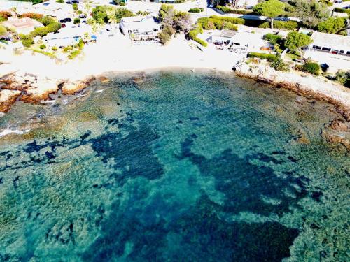 an aerial view of a pool of water next to a beach at Villa sunbeach in Roquebrune-sur-Argens