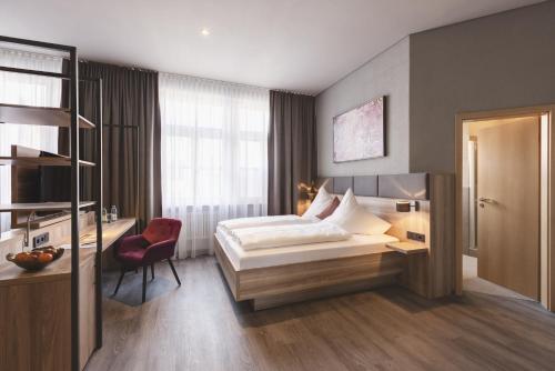 Postel nebo postele na pokoji v ubytování Hotel Das Bischof