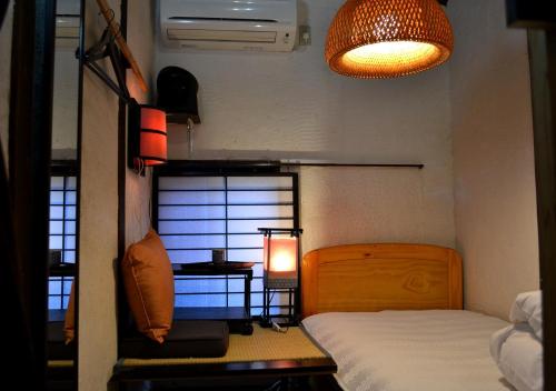 Kyoto Shirakawa Kiraku Innにあるベッド