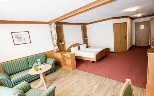 Ένα ή περισσότερα κρεβάτια σε δωμάτιο στο Hotel Gerbe