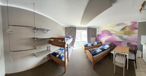 Postel nebo postele na pokoji v ubytování Hostel Fehmarn Ferienwohnung