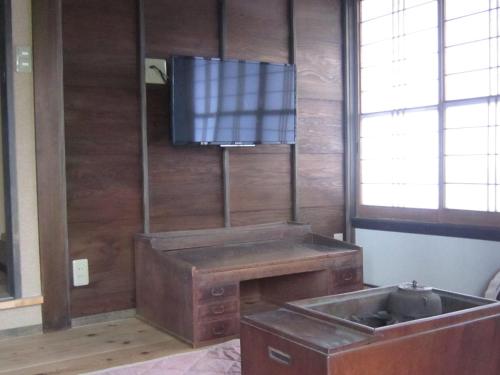 a kitchen with a sink and a flat screen tv at Marina bay Numazu マリーナベイ沼津 BBQ可 in Numazu