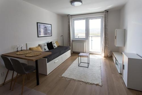 Posezení v ubytování Útulný byt s výhľadom na Tatry