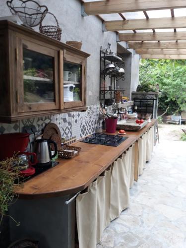 a kitchen with a long counter with a counter top at casa di Rosa in Patrimonio