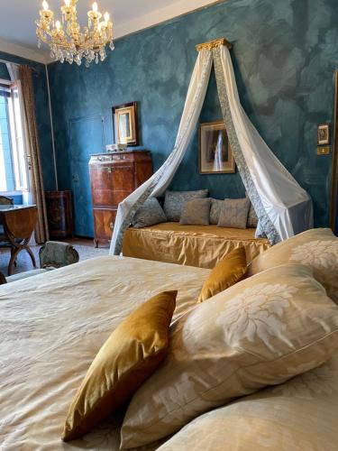 a bedroom with two beds and a chandelier at Gabrielle's room in Venice