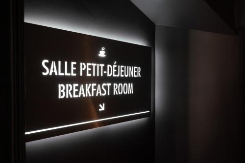 a sign that says saleptic bathroom breakfast room at Hotel Saint-Louis en L'Isle - Notre-Dame in Paris