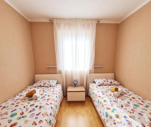 Katil atau katil-katil dalam bilik di Bellistra apartman Rabac - E