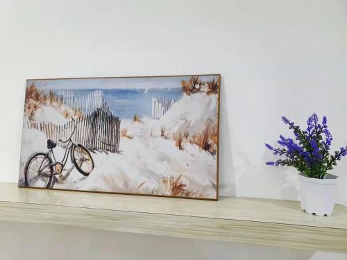 a painting on a wall with a bike on a shelf at Bukit Indah Nearby Aeon Issix 4 rooms up to 8 pax in Johor Bahru