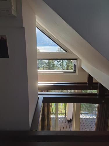 a large window in a room with a wooden floor at BALCON Apartments in Bled