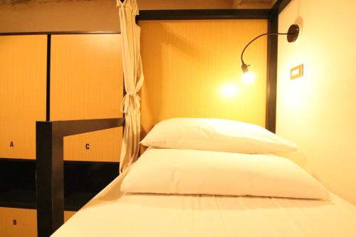 Postel nebo postele na pokoji v ubytování DONGMEN 3 Hostel