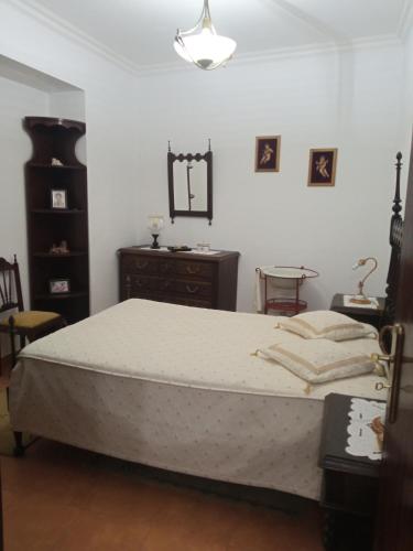 Ένα ή περισσότερα κρεβάτια σε δωμάτιο στο Casa das Festas