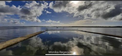 a large body of water with clouds in the sky at Seascape on the edge of town: 4 beds all ensuite. in Belmullet