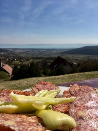 a plate of food with vegetables on top of a hill at KisVulkán Nyúlontúl in Mencshely