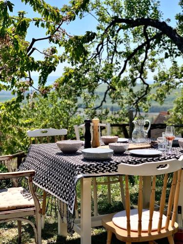 a table with a black and white checkered table cloth at KisVulkán Nyúlontúl in Mencshely