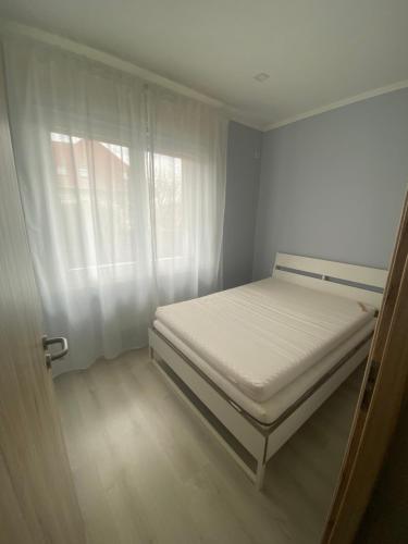Postel nebo postele na pokoji v ubytování Budapest Apartman