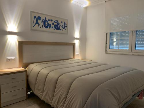 A bed or beds in a room at Apartamento Xoel