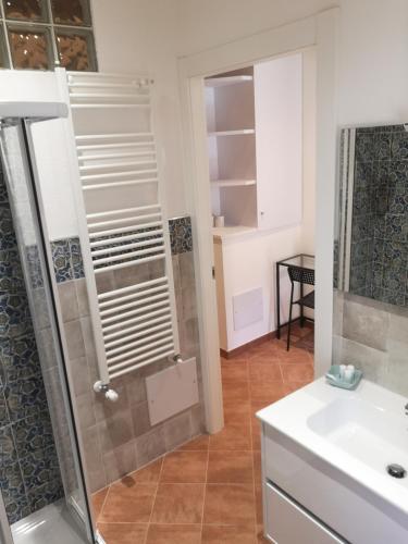 a bathroom with a shower and a sink at Elicriso Apartment Affittacamere in Borzonasca
