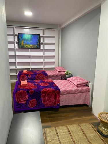 Postel nebo postele na pokoji v ubytování JAN Homestay Shillong