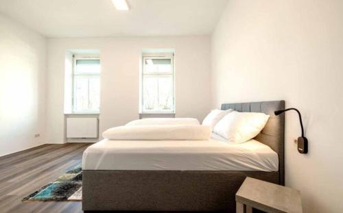 Postel nebo postele na pokoji v ubytování City Apartments Amstetten