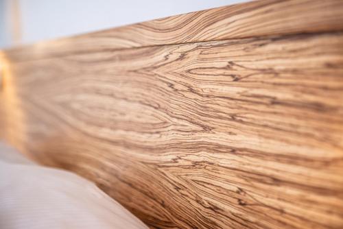 a close up of a wooden table with wood grain at Casino & Hotel ADMIRAL Kozina in Kozina