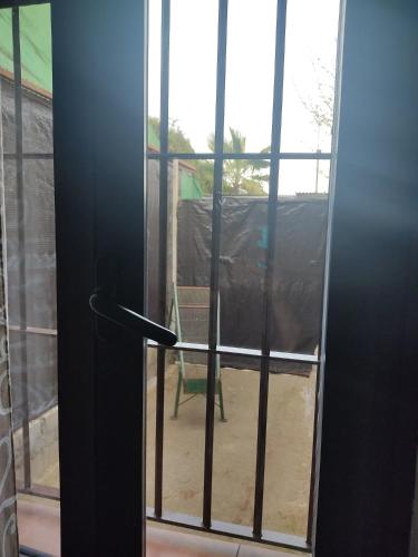 an open door with a view of a yard at Casa Cueva El Almendro in Pegalajar