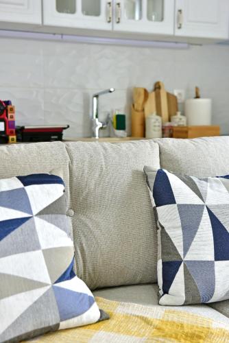 a couch with two pillows on it in a kitchen at Olivo luxury apartment in Hydra