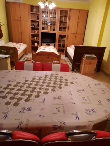 a room with a table with a blanket on it at Méz-Bor Szállás in Báránd