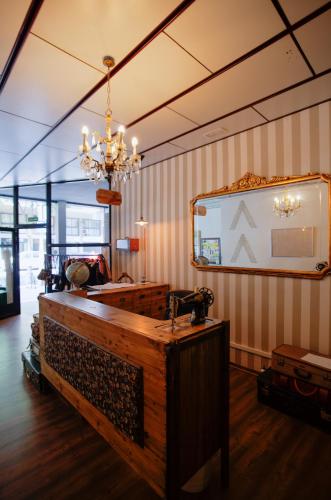 a room with a mirror and a dressing table at Pars Tailor's Hostel in Barcelona