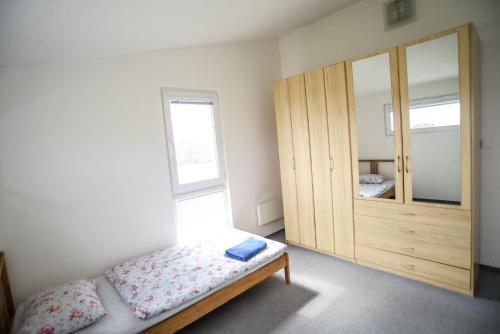 Ένα ή περισσότερα κρεβάτια σε δωμάτιο στο Apartmány Klimkovice