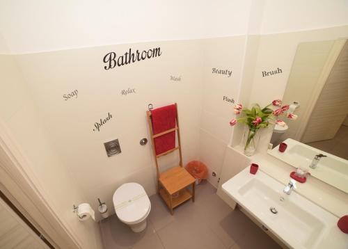 a bathroom with a toilet and a sink and a mirror at B&B Lamezia Terme in Lamezia Terme