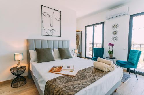 Кровать или кровати в номере L'Hotelet del Delta - adults