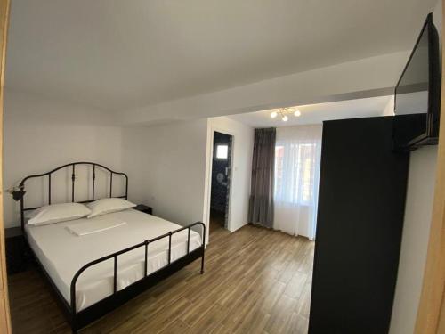 Postel nebo postele na pokoji v ubytování Casa Ciobi