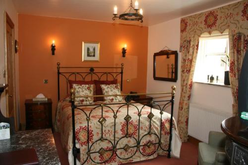A bed or beds in a room at Ferraris Country House Hotel 