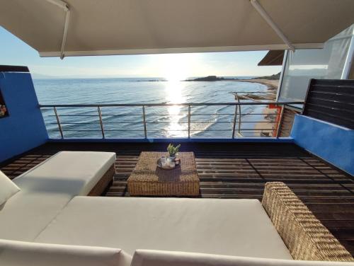 a balcony on a cruise ship looking out at the ocean at La Casa Azul in Arkoudi