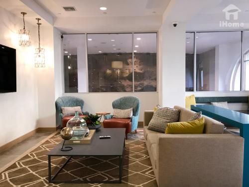 a living room with a couch and a table at Perfect Apt near UCLA w Parking Gym Pool WIFI in Westwood B3 in Los Angeles