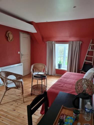 En eller flere senge i et værelse på Domaine De La Cour Vautier