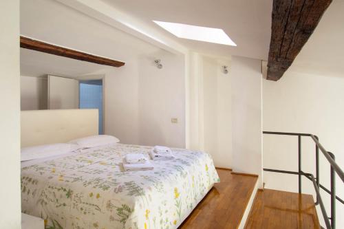 Giường trong phòng chung tại Vasco Pratolini Apartment
