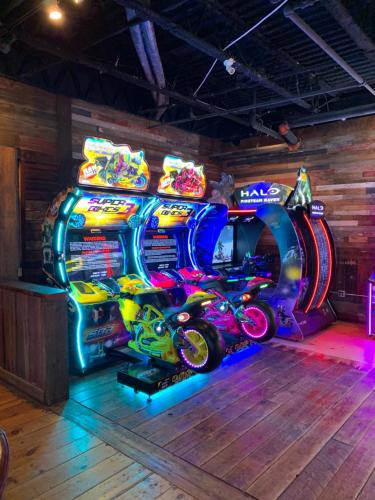 an arcade game with a motorcycle in a room at AmericInn by Wyndham Rochester Near Mayo Clinic in Rochester