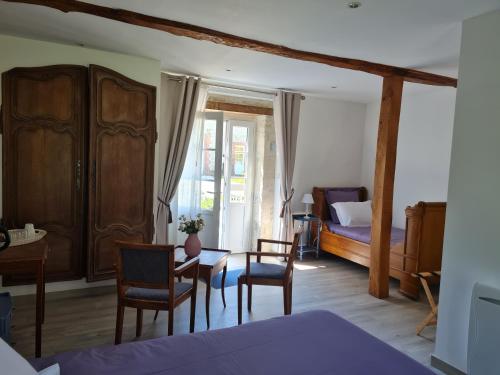 Postel nebo postele na pokoji v ubytování Domaine De La Cour Vautier