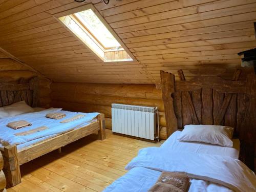Кровать или кровати в номере Hotel Berloga-Sinevir