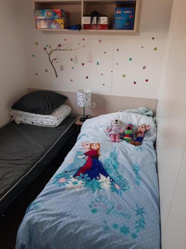 a bedroom with a bed with toys on it at LA CARABASSE CP90 in Vias
