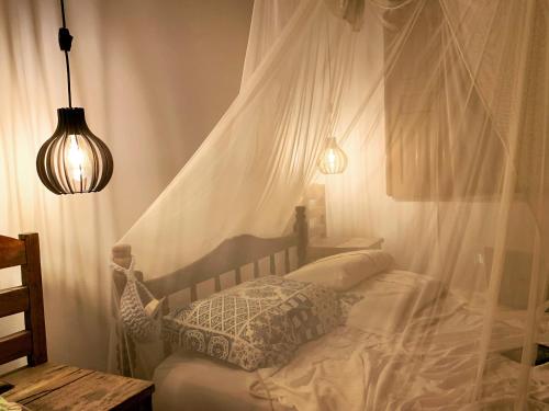 Postel nebo postele na pokoji v ubytování Casa no coração da vila de Caraiva