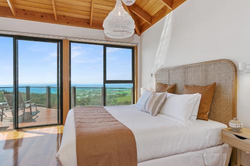 A bed or beds in a room at Point of View Villas