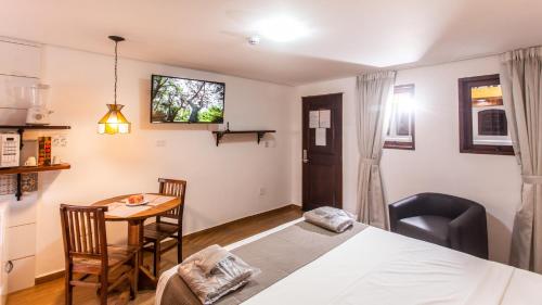 Ένα ή περισσότερα κρεβάτια σε δωμάτιο στο Hotel Chalet Monet - Granja Vianna