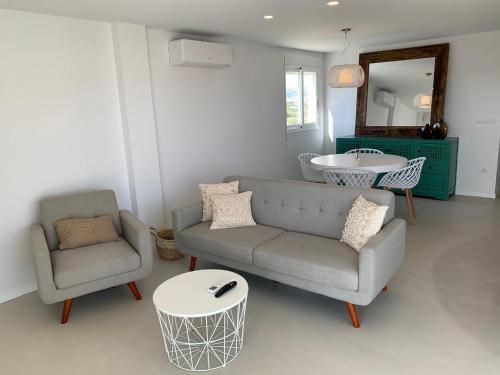 A seating area at Beautiful apartment with pool near the beach