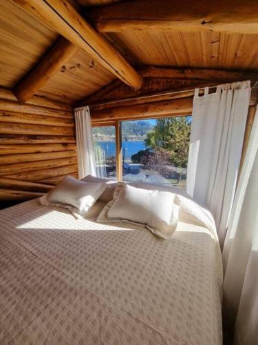 Postel nebo postele na pokoji v ubytování Puerto Cabañas Lacar