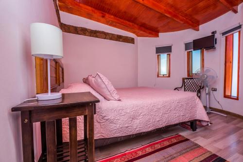 Ένα ή περισσότερα κρεβάτια σε δωμάτιο στο Hotel Parina Atacama