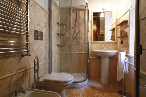a bathroom with a shower and a toilet and a sink at Casa Vacanza Colosseo in Rome